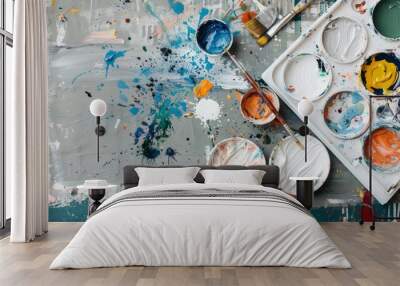 An artist's studio filled with colorful paint splatters and textured canvases Wall mural