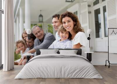 Family relaxing on porch together Wall mural