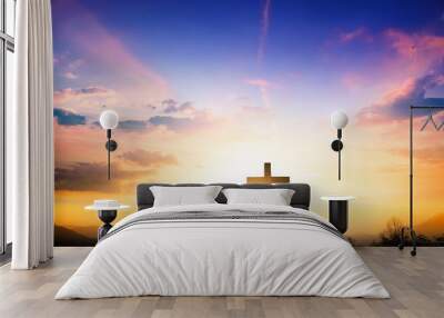 Christmas concept: The cross on mountain sunset background Wall mural