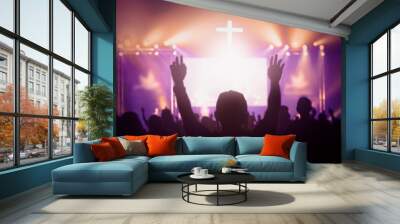 Concept of Jesus Christ: white cross on sunset sky background Wall mural