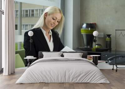 business woman working at her desk Wall mural