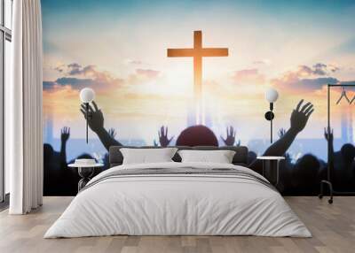 Easter and Good Friday concept,  soft focus of Christian worship with raised hand on cross sunset background Wall mural