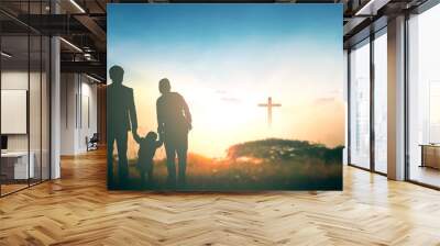 Family concept: Parents and children pray together on the cross background Wall mural