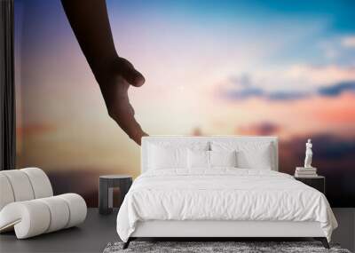 God's helping hand and cross on sunset background
 Wall mural