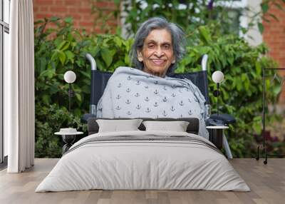 Elderly Asian Indian woman in nursing home, care home or garden Wall mural