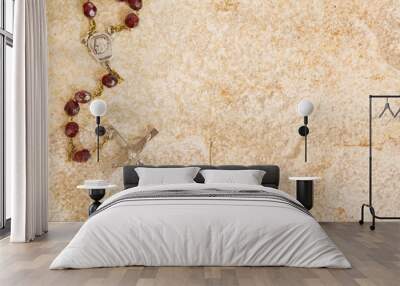 Rosary beads on a sandstone background Wall mural