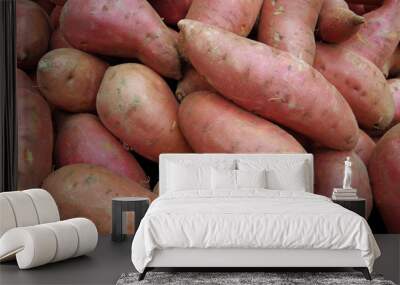 Sweet potatoes piled for market Wall mural