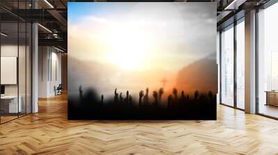 Praise and worship concept:Silhouette of Christian prayers raising hand while praying to the Jesus Wall mural