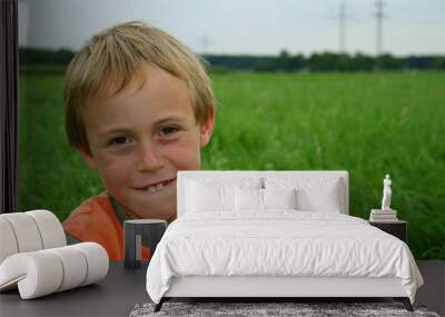 boy in field Wall mural