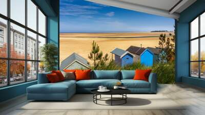 seaside beach huts at low tide against beautiful beach and blue sky, Wells Next The Sea, Norfolk Wall mural