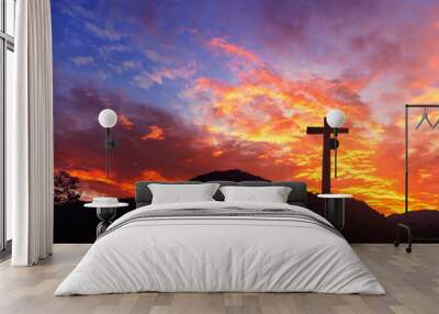 Silhouette the cross on sunset background Wall mural