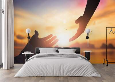 the concept of god's salvation:silhouette of helping hand concept and international day of peace Wall mural