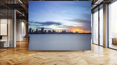 The sun rising over the skyline of Liverpool Wall mural