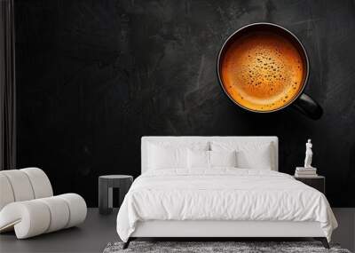 Top view of a coffee cup centered on a black background with extensive copy space, using studio lighting to create contrast Wall mural