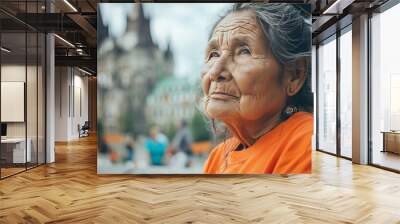 Traveler in an orange shirt at a significant landmark, marking the National Day for Truth and Reconciliation, captured in close-up Wall mural