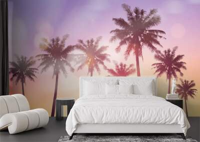 Tropical palm tree with colorful bokeh sun light on sunset sky cloud abstract background. Wall mural