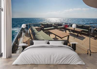 Table and chairs on stern deck of a luxury motor yacht Wall mural