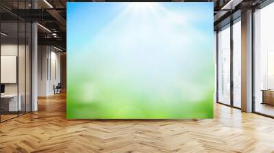 World environment day concept: green grass and blue sky abstract background with bokeh Wall mural