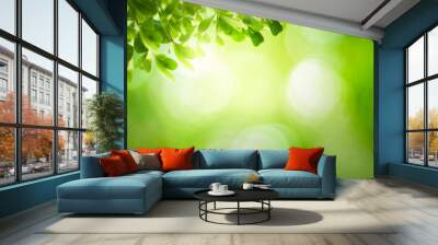 World environment day concept: green grass and blue sky abstract background with bokeh Wall mural