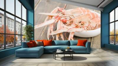 Bowl of boiled langoustines. Wall mural