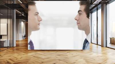 handsome young businessmen facing each other Wall mural