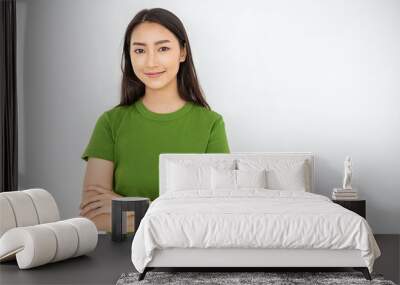 Attractive beautiful positive asian woman - close up portrait asian nerdy girl. Portrait of pretty nerd Japanese asia lady wearing green t shirt with smile isolated on white background. Wall mural