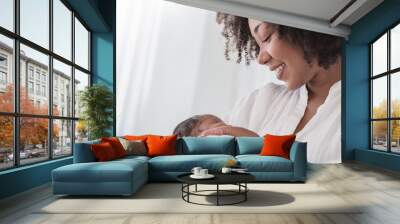 Close up portrait of beautiful young African American  mother holding sleep newborn baby in hospital. Healthcare medical love black afro woman lifestyle mother's day, breast concept with copy space. Wall mural