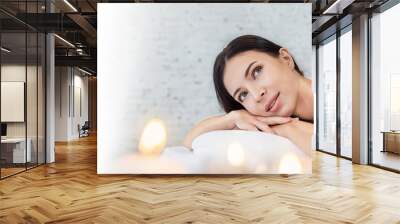 Closeup beautiful caucasian young  woman lying down on massage beds at Asian luxury spa and wellness center. Portrait of beauty asian woman relaxing with copy space, healthcare lifestyle banner. Wall mural