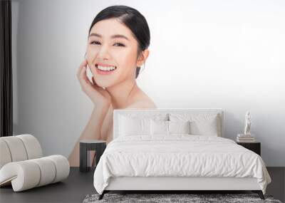 portrait of beauty asian woman with fair perfect healthy glow skin hand touching chin on white background, young beautiful asia girl with pretty smile face care. Beauty korean spa skincare. Wall mural