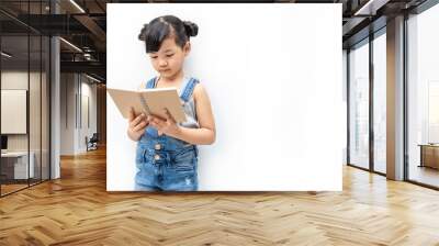 Portrait of little cute asian toddler girl reading book isolated on white background, Education knowledgement. Nerd reader girl studying, home school and back to school concept Wall mural