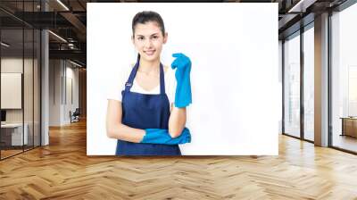 Portrait of young attractive smiling asian housewife in blue apron isolated on white background with copy space. Housekeeper woman wearing rubber gloves. Cleaner housewife worker lifestyle concept. Wall mural