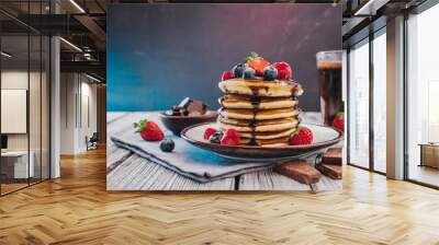 Delightful delicious stack of pancakes - freshly made breakfast - berries, chocolate, morning treat Wall mural