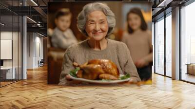 smiling old woman holding juicy roasted turkey for thanksgiving on background of family and table with food, generative AI Wall mural