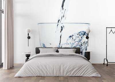 fresh water filling a glass isolated on white Wall mural