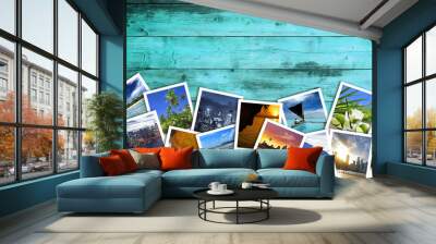 heap of travel photos on azure wood background Wall mural