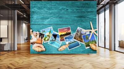 travel photos and seashells on azure wood background Wall mural