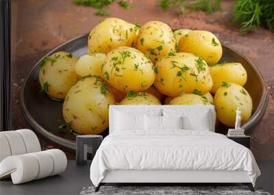 Deliciously seasoned boiled potatoes on a rustic brown background Wall mural