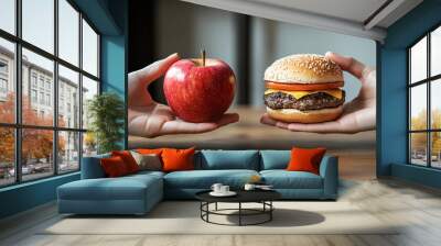 Making a choice between a healthy apple and a junk food hamburger Wall mural