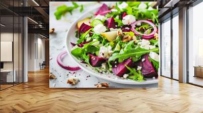 nutrient-packed beet and feta salad with arugula and walnuts on a white kitchen table - an appetizin Wall mural