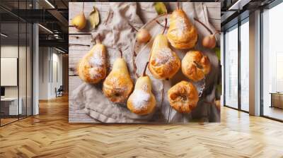 Pear Perfection: Baked Pears in Puff Pastry with Powdered Sugar on Rustic Wooden Table Wall mural