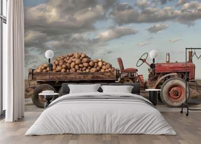 Rustic Charm: A Vintage Tractor Hauling a Heap of Potatoes Wall mural