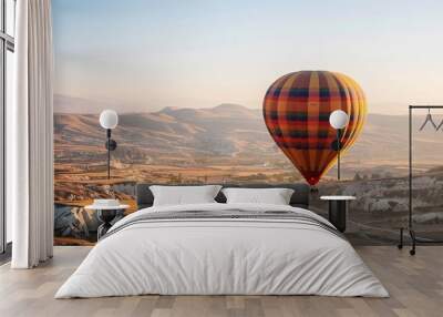 Vibrant Rainbow Hot Air Balloon Soaring Above Cappadocia, Turkey Wall mural