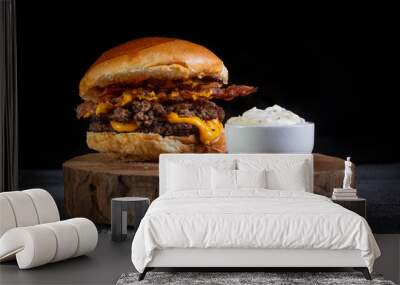 Two smash burgers with cheddar cheese, bacon and garlic sauce. Rustic craft burger. Wall mural