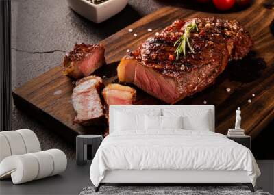 Fresh grilled meat. Grilled beef steak medium rare on wooden board. Picanha. Top view. Wall mural