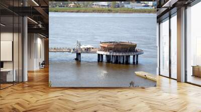 Plock, Poland. View at the Vistula river and pier with promenade. The pedestrian pier in Plock with the restaurant situated at the end  Wall mural