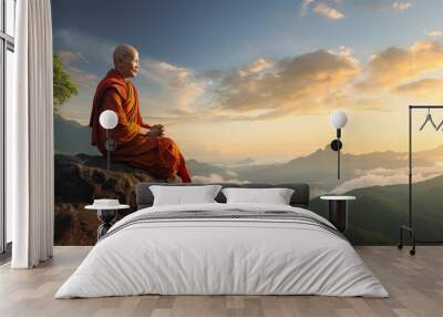 Buddhist monk in meditation at beautiful sunset or sunrise background on high mountain Wall mural