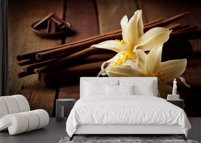 Dried vanilla sticks and vanilla orchid on wooden table. Close-up. Wall mural