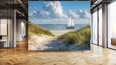 Footpath in sand dunes to beach and sailboat Wall mural