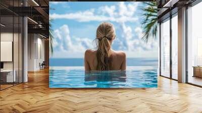 Travel vacation luxury resort idyllic overwater bungalow villa woman relaxing by infinity pool. Elegant beautiful lady in bikini, by perfect blue ocean water Wall mural