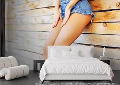 beautiful sexy woman in jeans shorts & sneakers. outdoor lifesty Wall mural